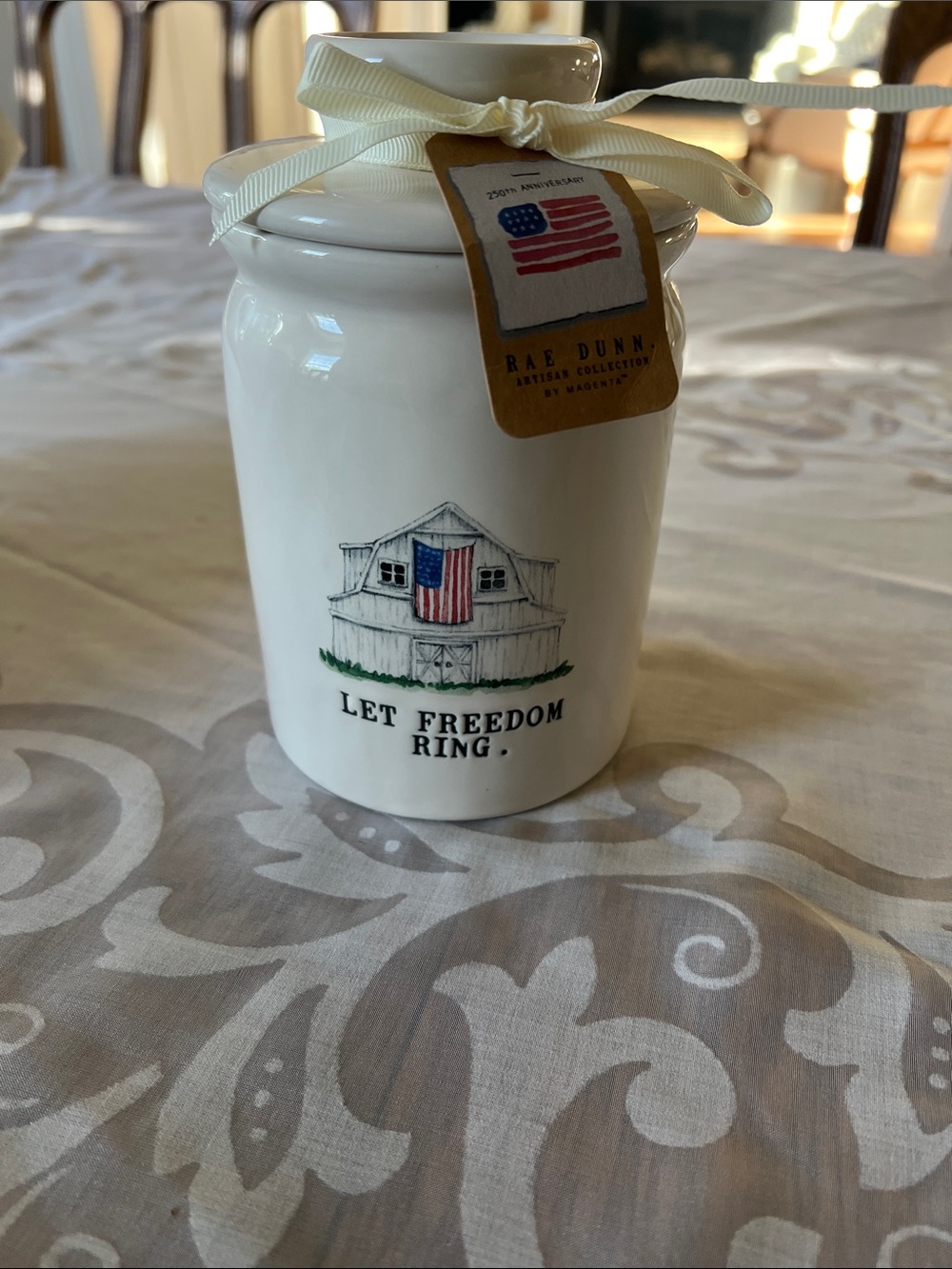 Rae Dunn white ceramic jar with red and blue patriotic accents